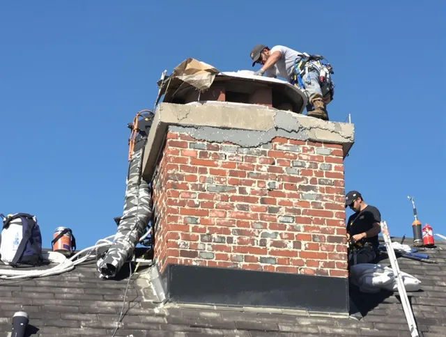 University Heights Chimney Sweep installing a custom chimney crown in University Heights, OH