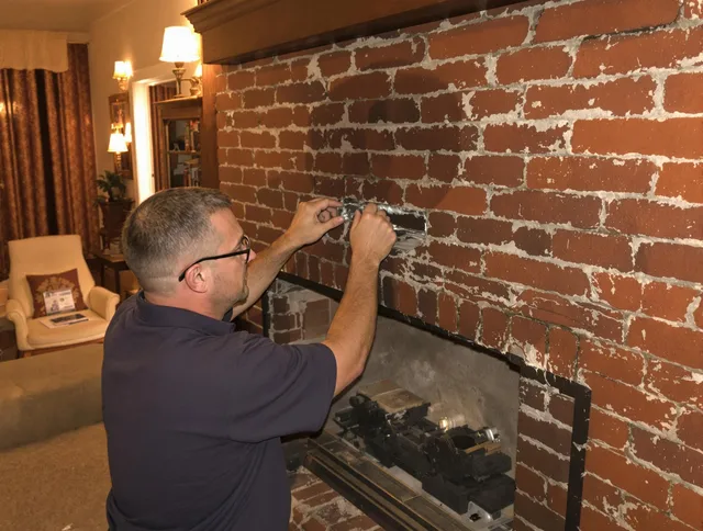 University Heights Chimney Sweep expert fixing a fireplace in University Heights, OH